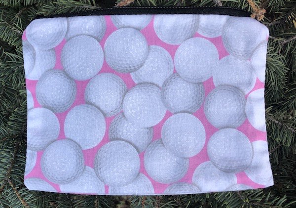 Golf Balls on Pink zippered bag, The Scooter