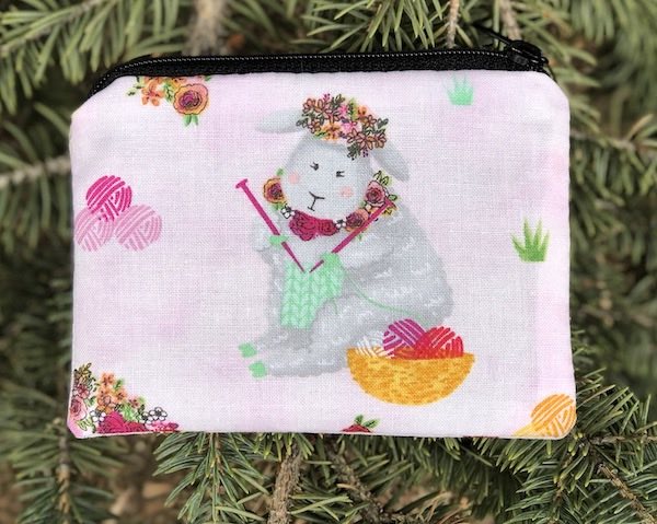 Knitting Goddess on pink coin purse, The Raven