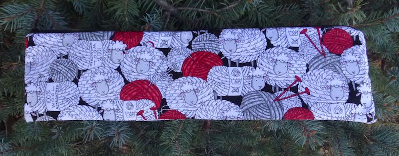 skeins of wool that look like sheep long case for knitting needles