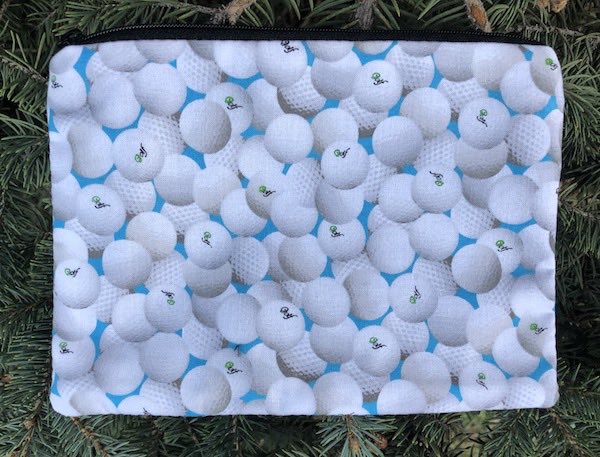 Golf Balls on Blue zippered bag, The Scooter