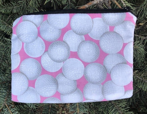 Golf Balls on Pink zippered bag, The Scooter
