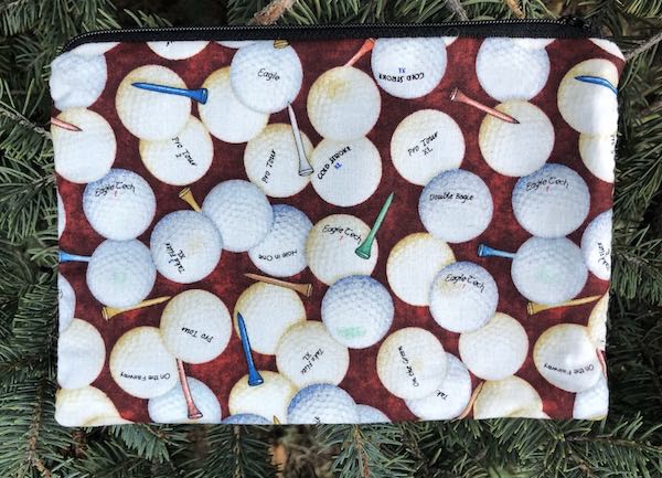 Golf Balls on Brown zippered bag, The Scooter