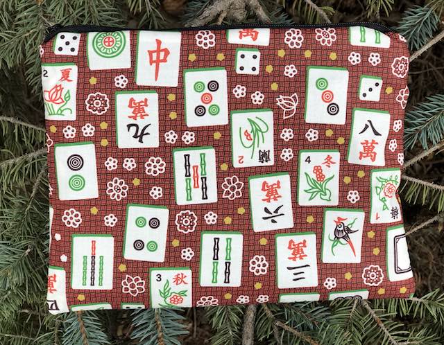 Mahjong tiles on red Mahjongg card and coin purse, The Slide