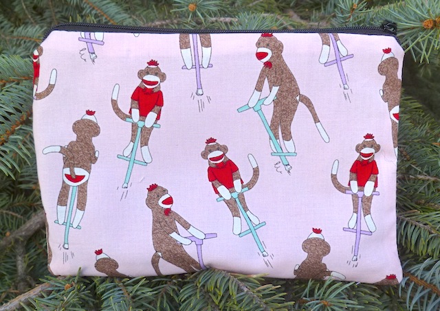 Sock Monkeys on Pogo Sticks in pink zippered bag, The Scooter